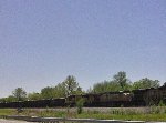 NB ballast train eases uphill to a stop.